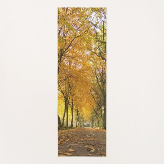 Autumn path with yellow trees and fallen leaves ヨガマット (正面)