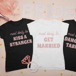 Bachelorette Party Most Likely To Dance On Tables Tシャツ<br><div class="desc">This funny personalized bachelorette party "Most likely to dance on tables" t-shirt is the perfect way to celebrate the bride-to-be! The playful script and modern font create a trendy look, while the spacious back design provides plenty of room for additional personalization or group names. Whether you're hitting the town or...</div>