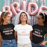 Bachelorette Party Most Likely To Get Married Tシャツ<br><div class="desc">Bring a touch of playful anticipation to the bachelorette festivities with this charming and customizable t-shirt design! Featuring the perfectly fitting phrase "most likely to GET MARRIED" in delicate pink lettering against a crisp white background, this design is both sweet and sassy. It's an ideal choice for the bride-to-be or...</div>