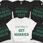 Bachelorette Party Most Likely To Kiss A Stranger Tシャツ<br><div class="desc">Inject some bold fun into your celebration with this daring and customizable t-shirt design! Featuring the cheeky phrase "most likely to KISS A STRANGER" in sage green lettering against a stylish black background, this design is guaranteed to spark smiles and playful banter. It's the perfect choice for a bachelorette party...</div>