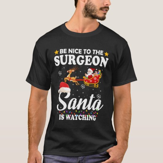 Be Nice To The Surgeon Santa Watching Xmas Tシャツ (正面)