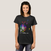 Beautiful dandelion with colourful spores flying a tシャツ (正面フル)