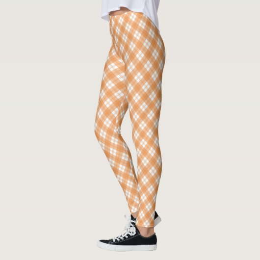 Beige and white checkered leggings displayed  レギンス (左)