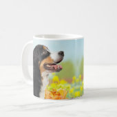 Bernese Mountain dog in the flower garden コーヒーマグカップ (正面左)
