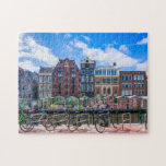 Bicycles Houses Along Amsterdam Canal Netherlands ジグソーパズル<br><div class="desc">This stunning city themed jigsaw puzzle features bicycles along the canal in Amsterdam with buildings in the background. #amsterdam #jigsawpuzzle #gift #stockingstuffers</div>