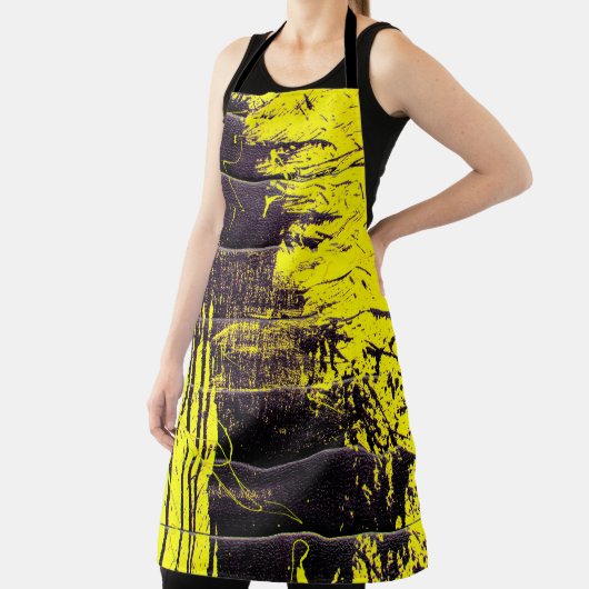 Black abstract splatter paint drips on a bright ye エプロン (インサイチュ)