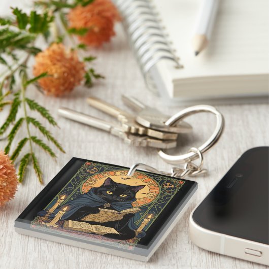 Black Cat Reading A Book Of Solstice Spells キーホルダー (正面右)