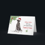 Black Lab Christmas from Dog in Santa おもしろい Hat カード<br><div class="desc">黒いおもしろい実験室の形をしたサンタは、このクリスマスのために特別なリマインダーを持っている！その犬は角に緑とホリーベリーの付いたサンタハットを着ている。あなたの犬から休暇のシーズンを望む完璧なカードメリー。</div>