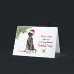 Black Lab Christmas from Dog in Santa おもしろい Hat カード<br><div class="desc">黒いおもしろい実験室の形をしたサンタは、このクリスマスのために特別なリマインダーを持っている！その犬は角に緑とホリーベリーの付いたサンタハットを着ている。あなたの犬から休暇のシーズンを望む完璧なカードメリー。</div>