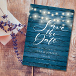 Blue Rustic Wood String Lights Save the Date ポストカード<br><div class="desc">This rustic save the date card features pretty string lights and an elegant script save the date above your details set in elegant typography on a rustic blue wood panels background. The reverse has additional save the date details, including your wedding website, with your return address and space for your...</div>