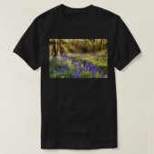 Bluebells woodland path with glowing sunrise light tシャツ (デザイン正面)