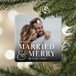 Bold Married & Merry Wedding Photo Newlywed セラミックオーナメント<br><div class="desc">Display a favorite wedding photo with this bold,  modern typography-based Christmas design,  featuring "married & merry" overlaid in white lettering joined by an oversized ampersand. Personalize with your wedding date and names. Design repeats on reverse side.</div>