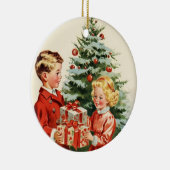 Boy and girl giving each other Christmas presents セラミックオーナメント (右)