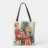 Boy and girl giving each other Christmas presents トートバッグ (裏面)