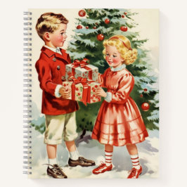 Boy and girl giving each other Christmas presents ノートブック