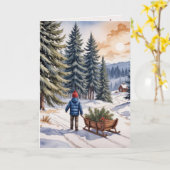 Boy Pulling a Sled With Christmas Evergreen Boughs カード (黄色い花)