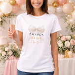 Bride to be ivory bow pearls elegant Bachelorette Tシャツ<br><div class="desc">Elevate your bridal events with this sophisticated coquette-themed party collection. Each piece showcases a high-fidelity white satin bow paired with delicate pearl accents and timeless typography. This set is perfect for the modern bride wanting a cohesive look for her bachelorette trip and bridal shower.</div>