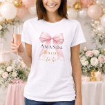 Bride to be pink bow pearls elegant Bachelorette Tシャツ<br><div class="desc">Elevate your bridal events with this sophisticated coquette-themed party collection. Each piece showcases a high-fidelity pink bow paired with delicate pearl accents and timeless typography. This set is perfect for the modern bride wanting a cohesive look for her bachelorette trip and bridal shower.</div>