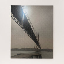 Bridge Silhouetted against the Sun in Lisbon