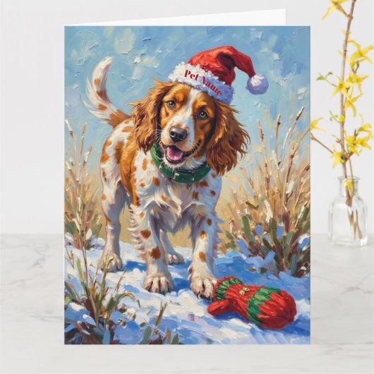 Brittany Spaniel Pointing at Santa's Glove Hat カード (黄色い花)