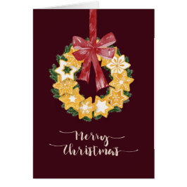 Burgundy背景を持つクリスマスクッキーリース