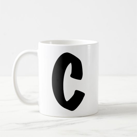 "C"のマグカップ コーヒーマグカップ (左)