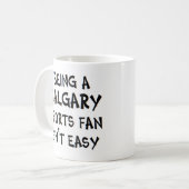 calgary sports fan, being コーヒーマグカップ (正面左)