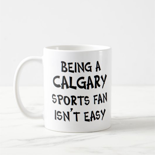 calgary sports fan, being コーヒーマグカップ (左)