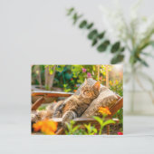 Cat sleeping in garden chair among flowers シーズンポストカード (スタンド正面)
