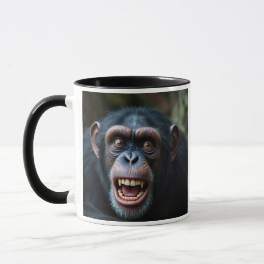 C'est qu'il fait peur le chimpanzé. マグカップ (左)