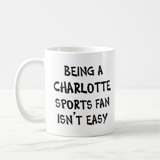 charlotte sports fan, being コーヒーマグカップ (左)