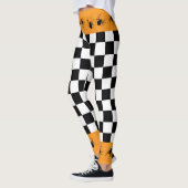 Checkered black white orange Halloween spiders レギンス (左)