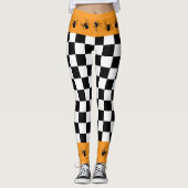Checkered black white orange Halloween spiders レギンス (正面)