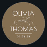 Chic Modern Minimalist Typography Brown Wedding ラウンドシール<br><div class="desc">Minimalist brown wedding seals place the couple’s names front and center — boldly presented and elegantly connected by a calligraphic “and” that adds a graceful,  romantic flourish.

Fully customizable to reflect your unique style — with adjustable text and background colors to perfectly complement your wedding aesthetic.</div>