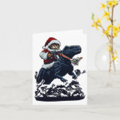 Christmas Cat In Santa Hat Holding A Gun And Dinos カード (黄色い花)