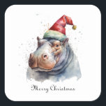 Christmas Hippo、カスタマイズ可能 スクエアシール<br><div class="desc">クリスマス絵を描スタイルの赤い冬帽子とヒッポの水色の帽子</div>