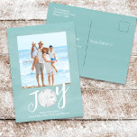 Christmas Holiday Joy Photo Simple Beach Budget  シーズンポストカード<br><div class="desc">This design features Christmas holiday modern Christmas holiday noel simple modern, nautical beach tropical vacation photo, family picture 1 one turquoise, and dollar coastal tropical ocean, seaside sea life turquoise teal, trendy stylish unique typography text, whimsical calligraphy script font, modern holiday island minimalist, Christmas holiday photo budget greeting postcards, simple...</div>