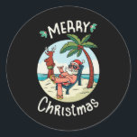 Christmas in July ラウンドシール<br><div class="desc">Funny Christmas design featuring an illustration of Santa Claus relaxing at the beach under a palm tree on a little island. A perfect match for Christmas in July as well as for real Christmas in December.</div>