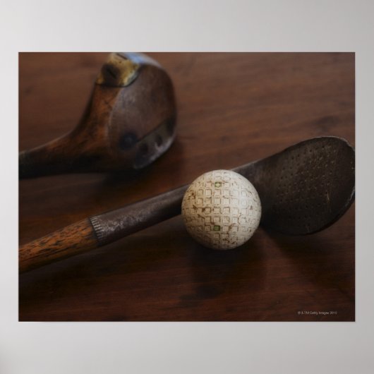 Close up of antique golf clubs and golf ball ポスター (正面)