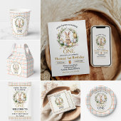 いくつかの復活祭バニーが1日の誕生日を回している ペーパープレート