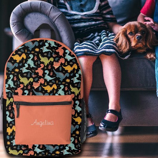 Colorful dinosaur pattern orange black name プリントバックパック