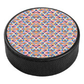 Colorful round speaker with a vibrant geometric  アイスホッケーパック (3/4)