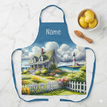 Cottage With View Of The Lighthouse エプロン<br><div class="desc">A dreamy coastal cottagecore landscape filled with soft watercolor charm and breezy seaside tranquility. A welcoming seaside cottage sits among lush garden paths, blooming flowers, and a bright white picket fence, creating a warm storybook atmosphere. In the distance, a tall lighthouse rises beside sparkling blue ocean waves, adding a classic...</div>