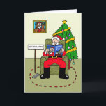 Covid 19 Christmas Quarantine Santa カード<br><div class="desc">独立自主の父クリスマスの漫画、彼の腕の読中のクリスマステレビガイド。</div>