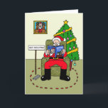 Covid 19 Christmas Quarantine Santa カード<br><div class="desc">独立自主の父クリスマスの漫画、彼の腕の読中のクリスマステレビガイド。</div>