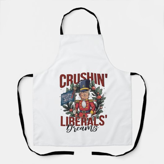 Crushing Liberals Dreams Trump Nutcracker Xmas エプロン (正面)