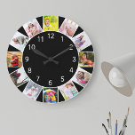 Custom 12 Photo Collage Black Round ラージ壁時計<br><div class="desc">Personalized photo clock with your own custom photos. The photo template is set up ready for you to add 12 of your favorite pictures working clockwise from the top. This smart black design has white numbers and will look great with modern and contemporary decor. For this design, square instagram photos...</div>