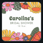 Custom Groovy Pink Orange Floral Bridal Shower  スクエアシール<br><div class="desc">This square sticker features a vibrant retro floral border with bold blooms in pink, orange, and yellow on a white background. The whimsical botanical design is paired with groovy 70s inspired typography for a playful and nostalgic aesthetic. A sophisticated way to personalize bridal shower favors or as a unique addition...</div>
