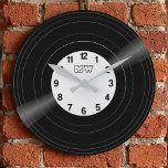 Custom Vinyl Record Vintage Monogram Clock ラージ壁時計<br><div class="desc">Bring the golden era of music into your home with this sleek, customizable vinyl record wall clock. Designed with a high-fidelity aesthetic, this clock features a realistic record groove image and a personalized center label. It is customizable: Change the background color of the record label and the clock numbers to...</div>