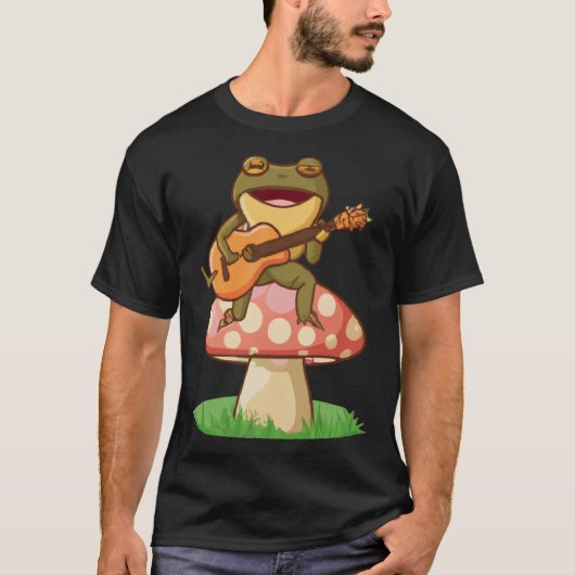 Cute Japanese frog playing guitar banjo on a mushr Tシャツ (正面)